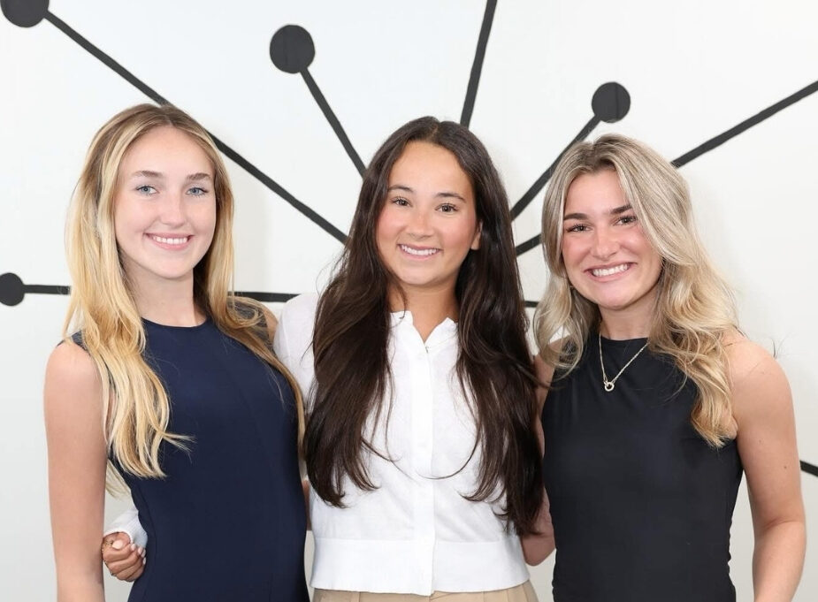 3 Interns standing in front of mural in studio at our marketing company in Palm Beach